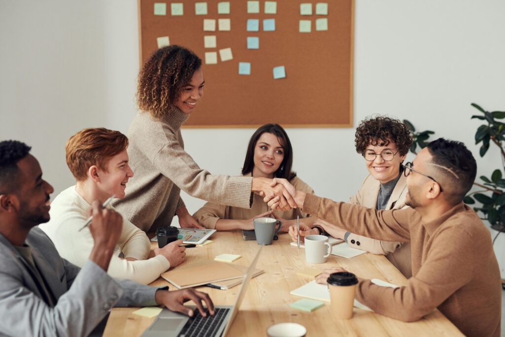 pexels-photo-3184291-3184291 Diverse team collaborating in a meeting, showcasing teamwork and cooperation in a modern workplace.